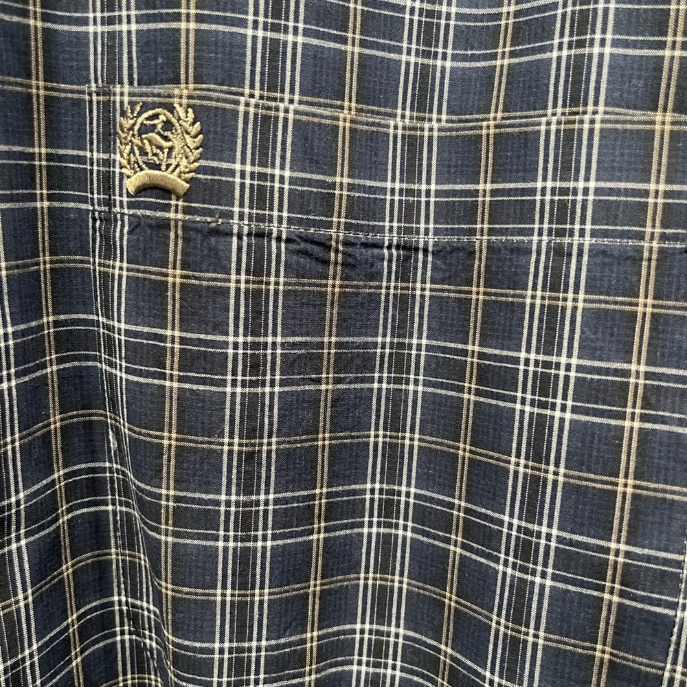 Cinch button down. Always sent to cleaners. Like New condition
